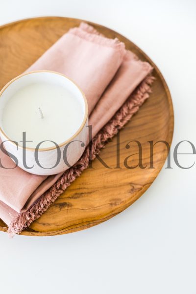 Vertical stock photo of candle on tray