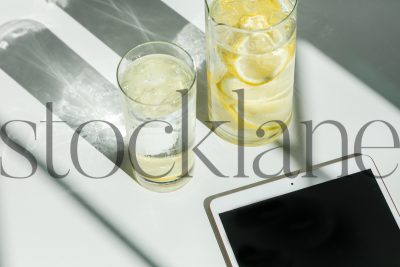 Horizontal stock photo of iPad and lemon water