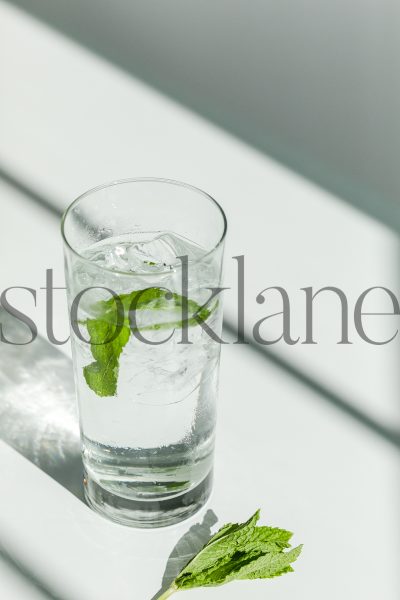 Vertical stock photo of water with mint