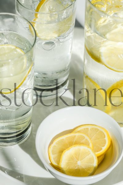 Vertical stock photo of water and lemons