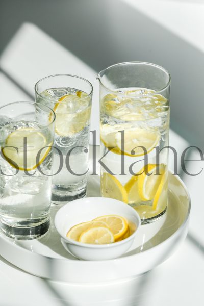 Vertical stock photo of water and lemons