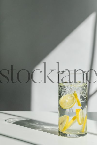 Vertical stock photo of water with lemon