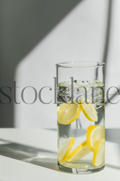 Vertical stock photo of water with lemon