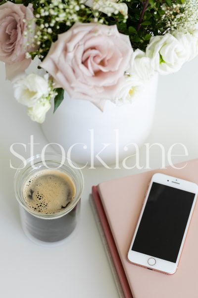 Vertical stock photo of white and pink desktop