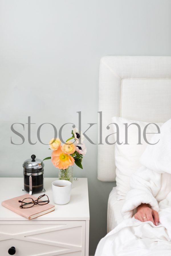 Vertical stock photo of feminine nightstand