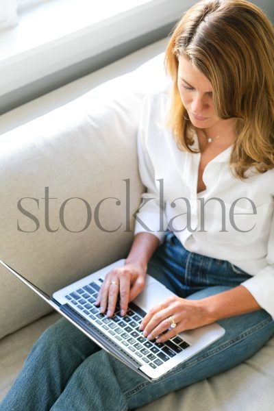 Woman working from home with laptop