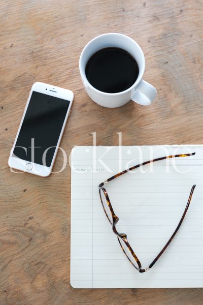 Vertical stock photo of coffee and phone