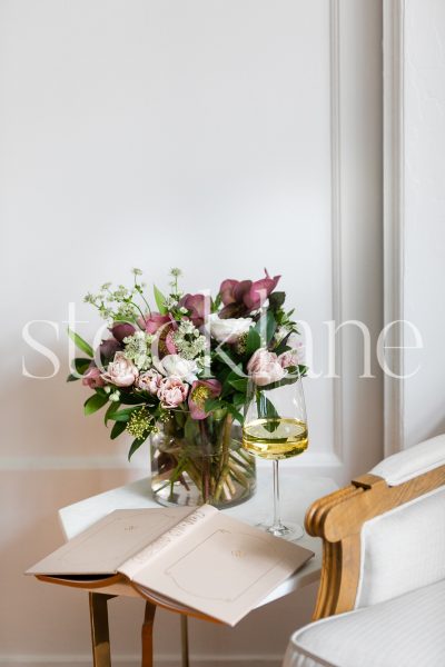 Vertical stock photo of wine and flowers