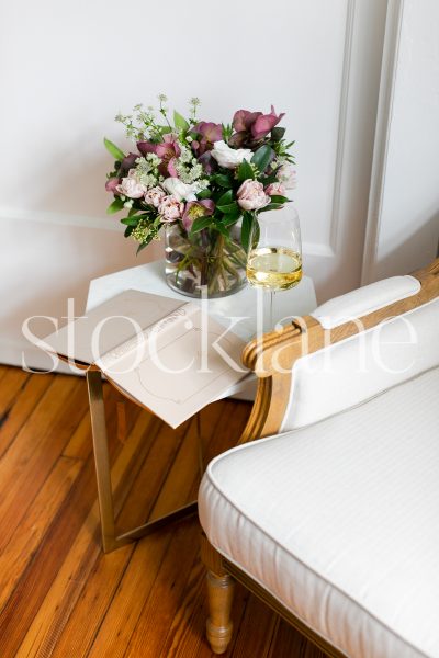 Vertical stock photo of flowers and wine