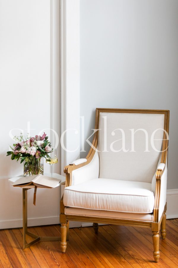 Vertical stock photo of armchair and flowers