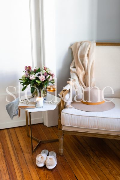 Vertical stock photo of chair, flowers and wine