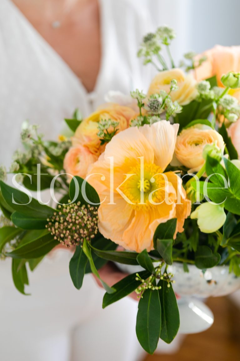 Vertical stock photo of flower arrangement with poppies