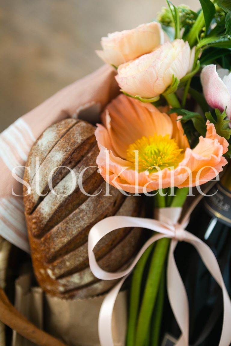 Vertical stock photo of bread and flowers