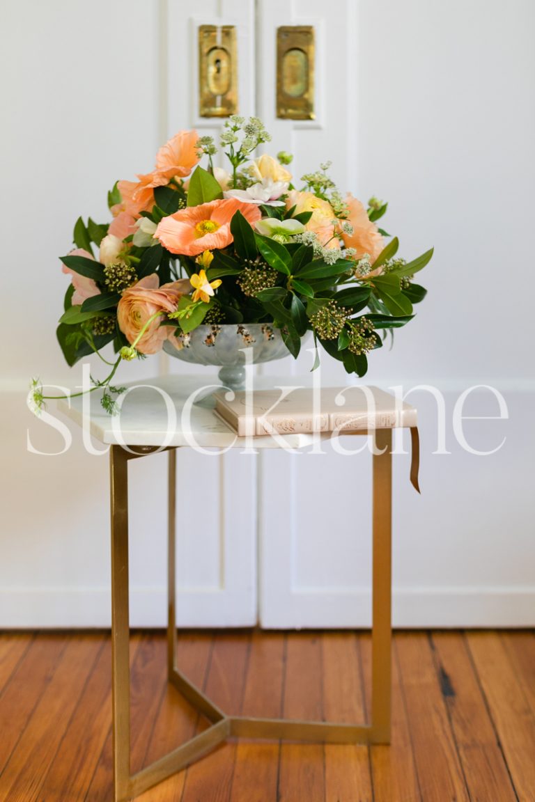 Vertical stock photo of table with flower arrangement