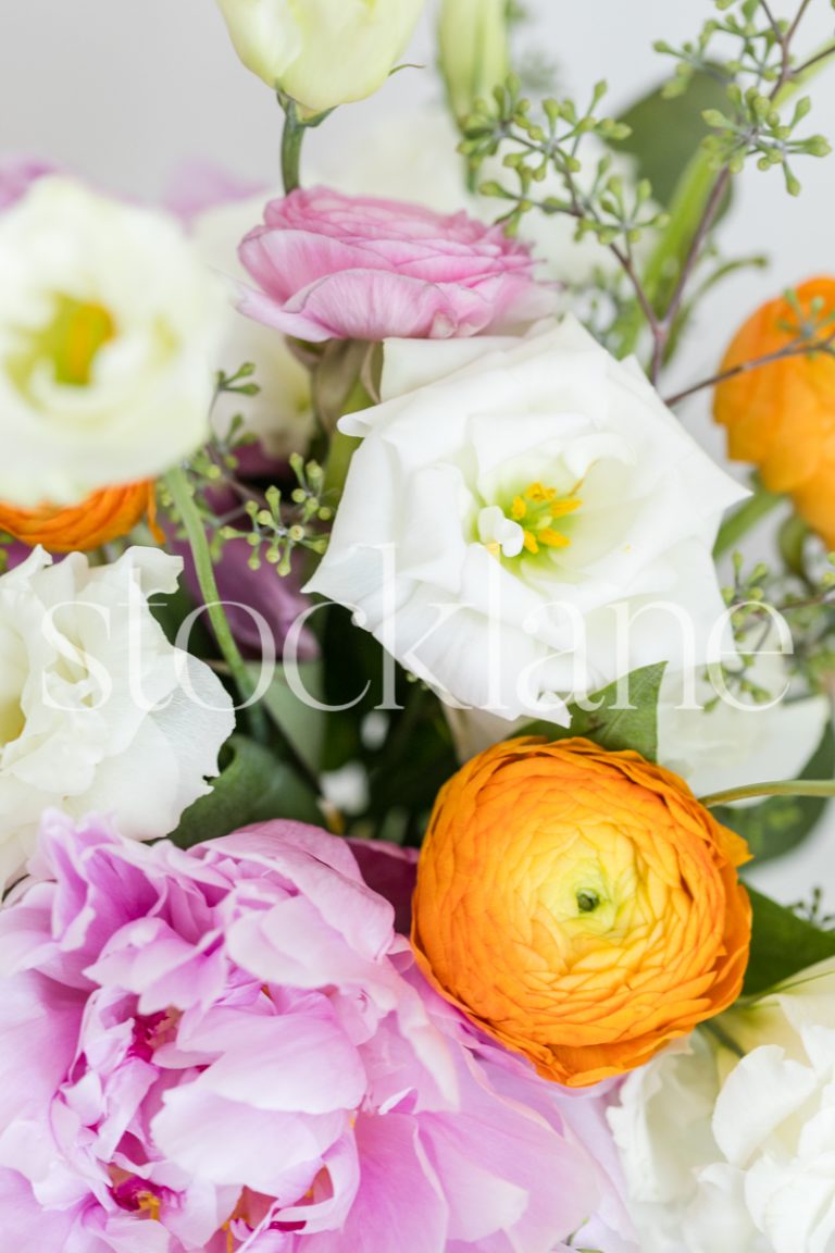 Vertical stock photo of pink, orange and white flowers