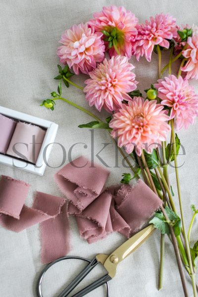 Vertical stock photo of pink dahlia flower bouquet.