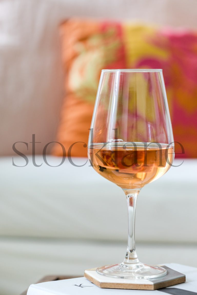 Vertical stock photo of coffee table with rose wine