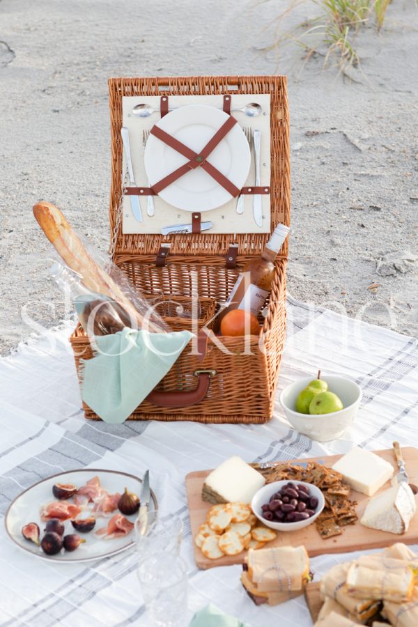 Vertical stock photo of a summer beach picnic.