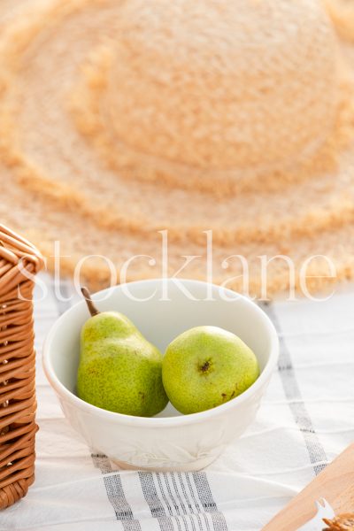 Vertical stock photo of a bowl with pears.