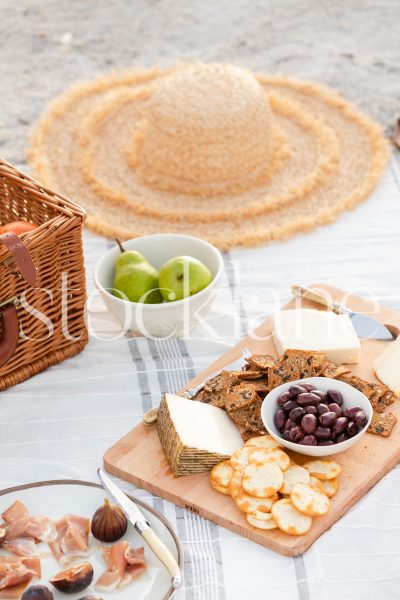 Vertical stock photo of summer beach picnic.