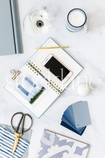 Vertical stock photo of blue designer desktop