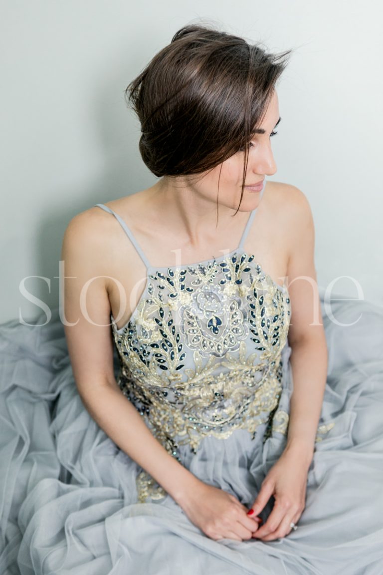 Vertical stock photo of a woman in a light blue dress