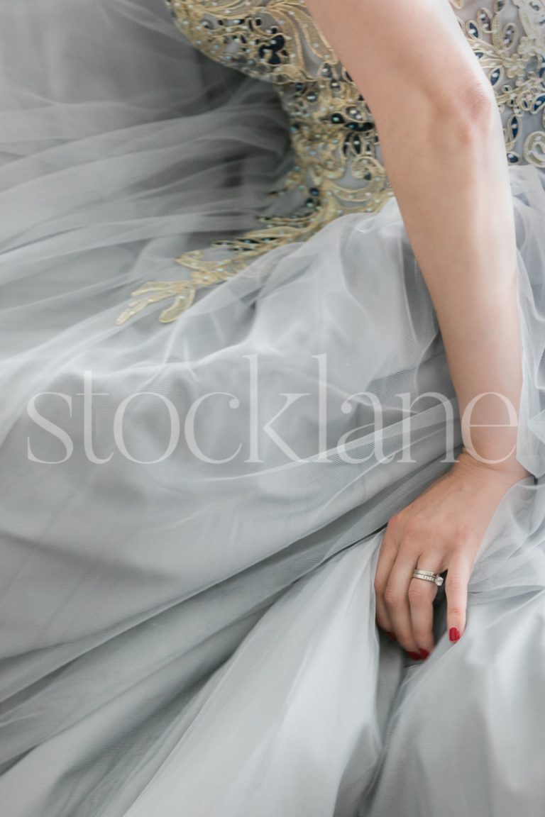 Vertical stock photo of a woman in a light blue dress