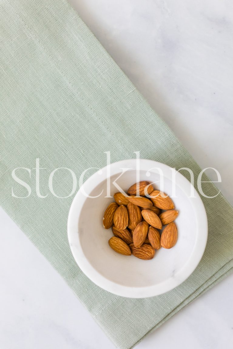 Vertical stock photo of a bowl of almonds