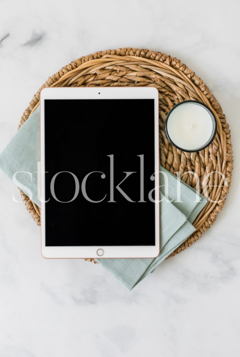 Vertical stock photo of a flat lay with an iPad