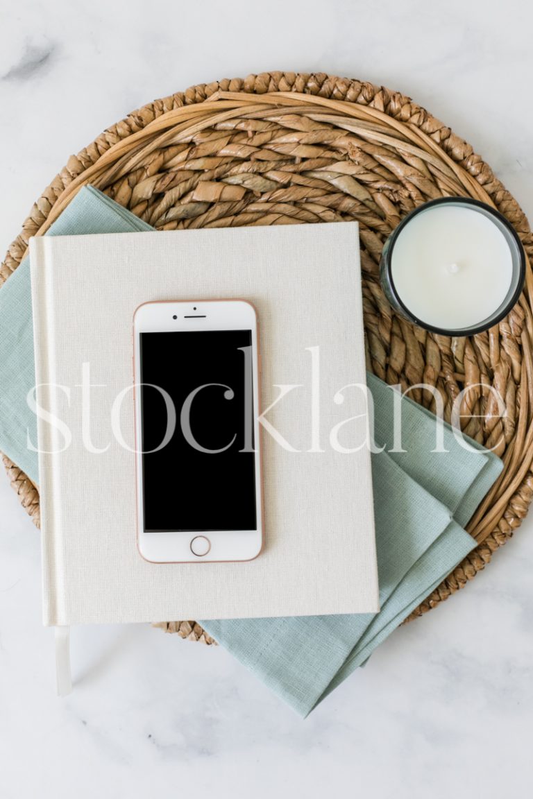 Vertical stock photo of a flat lay with an iPhone