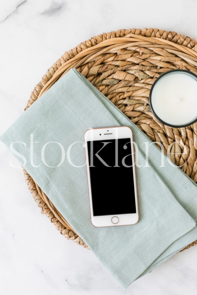 Vertical stock photo of a flat lay with an iPhone