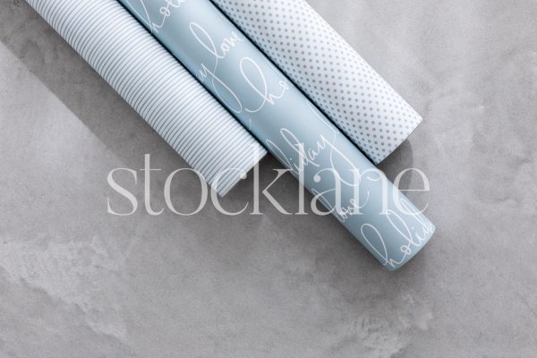 Horizontal stock photo of light blue wrapping paper.