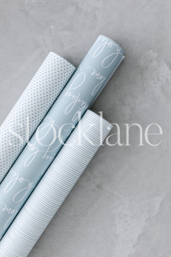 Vertical stock photo of light blue wrapping paper.