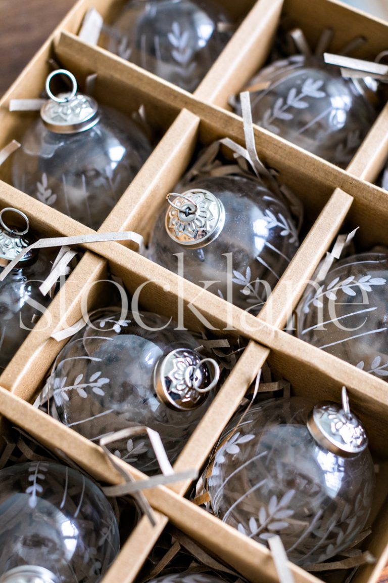 Vertical stock photo of glass Christmas ornaments.