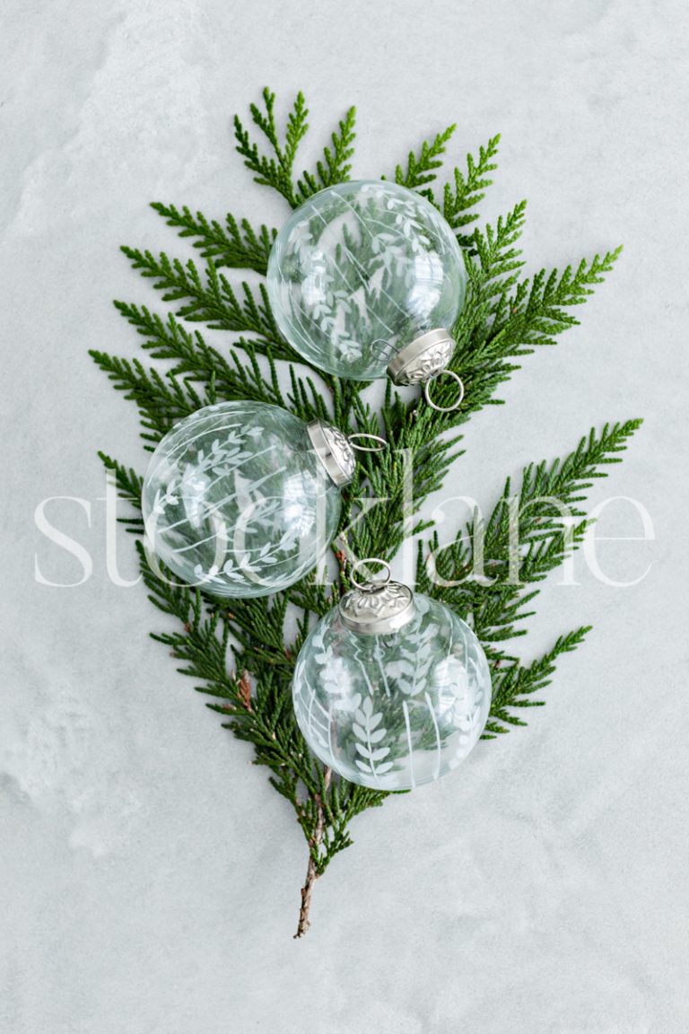 Vertical stock photo of glass Christmas ornaments.