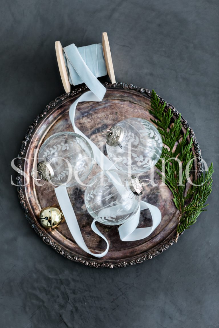 Vertical stock photo of glass Christmas ornaments.