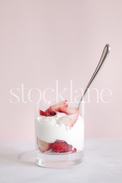 Vertical stock photo of strawberries and cream