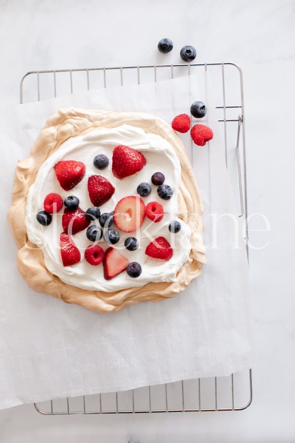 Vertical stock photo of a pavlova with berries