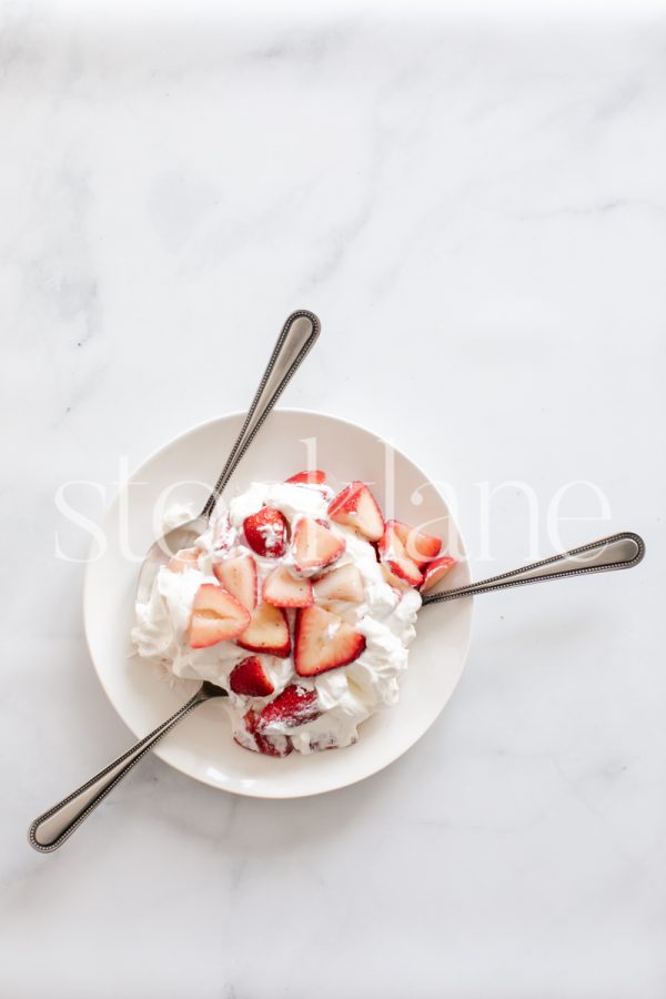 Vertical stock photo of strawberries and cream