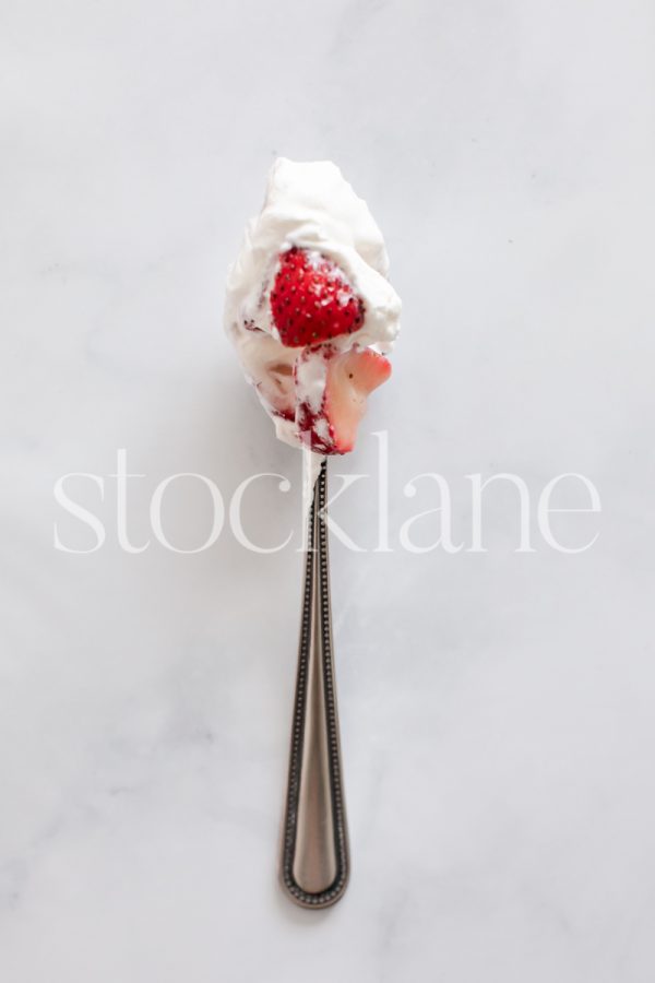 Vertical stock photo of strawberries and cream