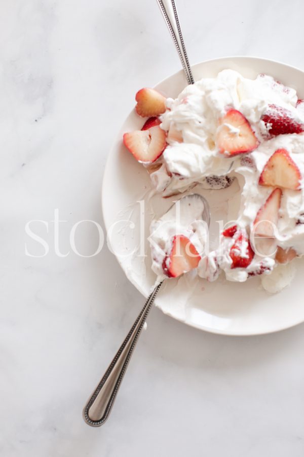 Vertical stock photo of strawberries and cream