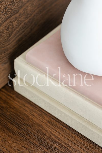 Vertical stock photo of a stack of books.