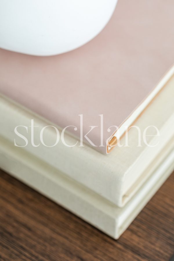 Vertical stock photo of a stack of books.