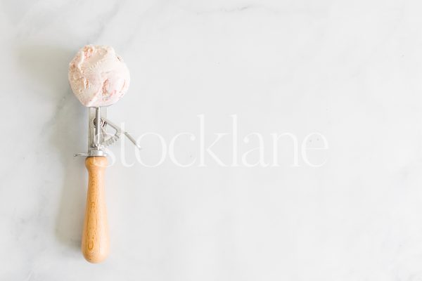 Horizontal stock photo of a scoop of strawberry ice cream