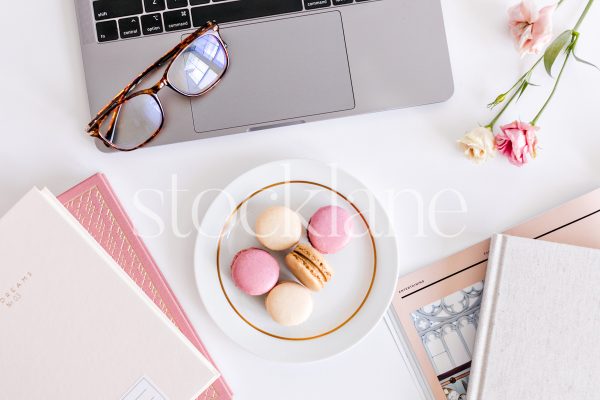 Horizontal stock photo of a woman's desktop in blush pink.