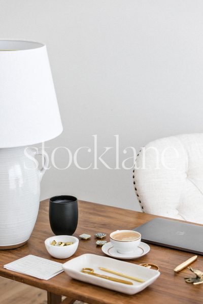 Vertical stock photo of a feminine office, in neutral colors.