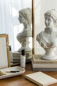 Vertical stock photo of a neutral color desktop arrangement.